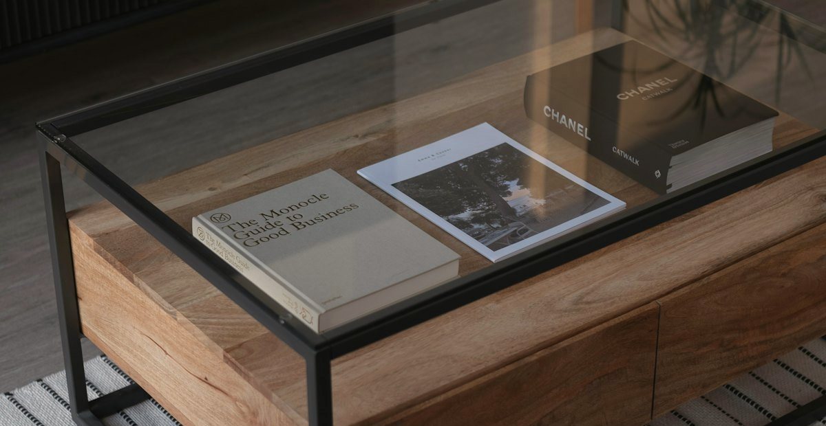 Editorial still life — business books on a warm interior table